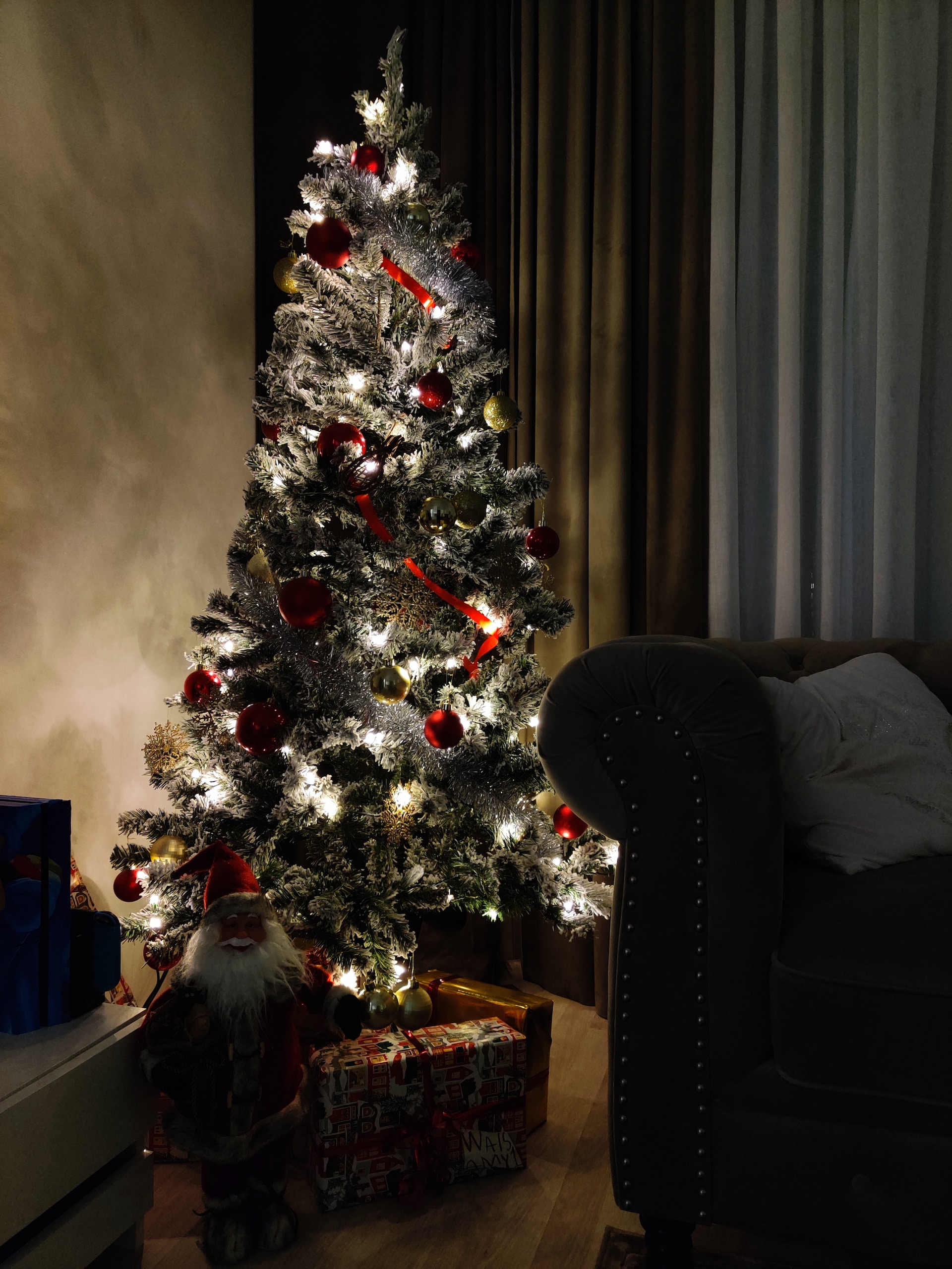 A decorated Christmas tree in a room.