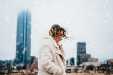 A woman posing in a snow-soaked Oklahoma City.