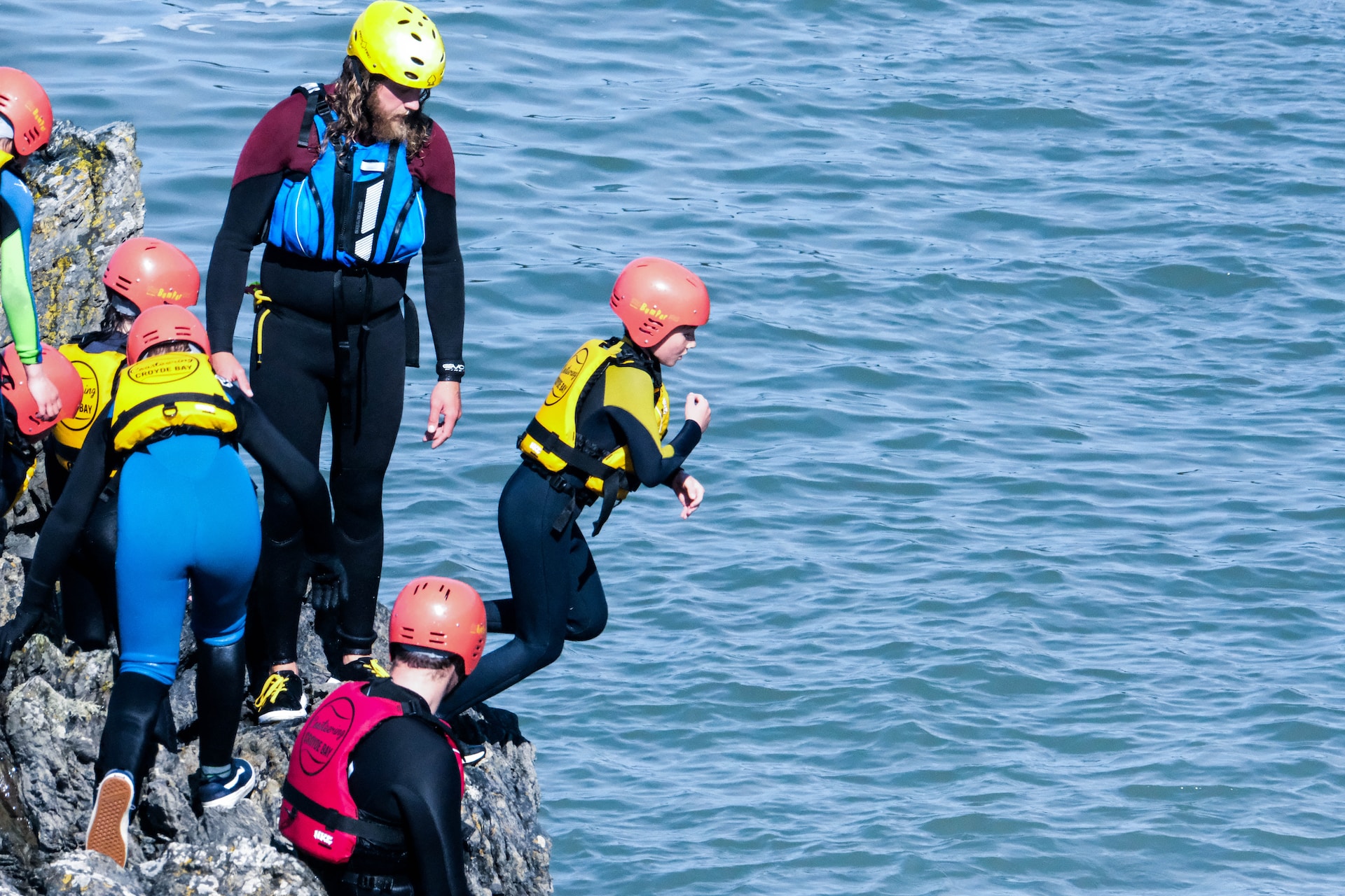 A coasteering group with the full gear.